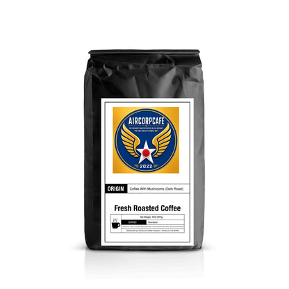 A black bag of Aircorpcafe Fresh Roasted Coffee with Mushrooms (Dark Roast) on a white background with a soft reflection.