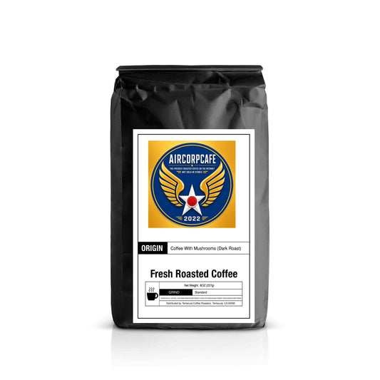A black bag of Aircorpcafe Fresh Roasted Coffee with Mushrooms (Dark Roast) on a white background with a soft reflection.